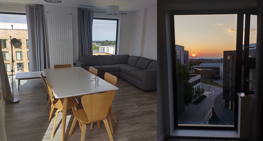 Kuva olohuoneesta ja maisemasta huoneiston ikkunan läpi.