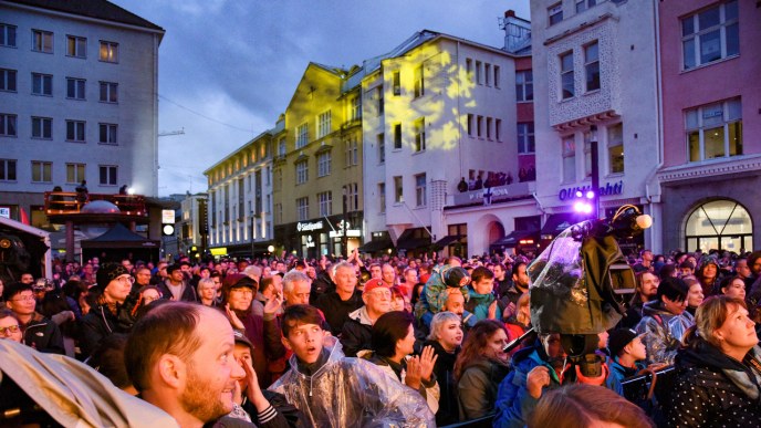 An audience in front of the Rotuaari stage outdoors.